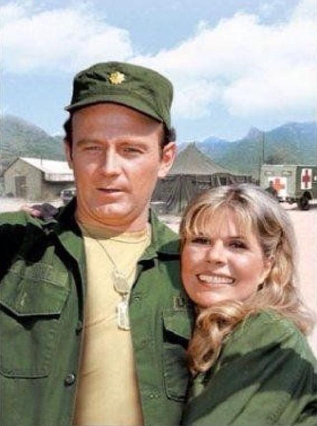 Loretta Swit with her co-star during a behind-the-scenes moment from the M*A*S*H series, capturing the camaraderie between the cast
