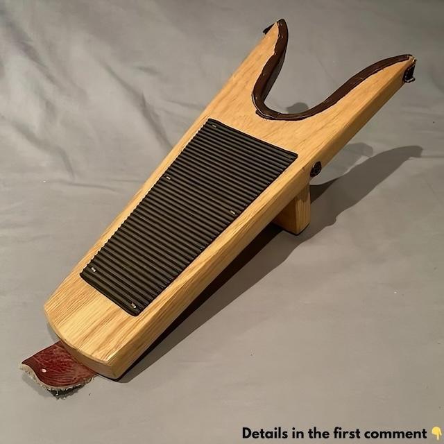 A sleek and simple wooden boot jack designed to help remove boots without hassle