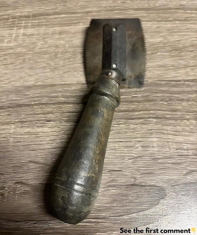 An old-fashioned veneer saw, worn down by years of use, but still carrying the history of precision woodworking in every detail