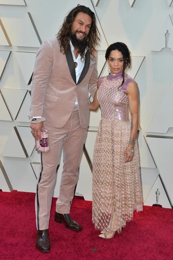 Jason Momoa and Lisa Bonet together at a past award show, showcasing their iconic red carpet style.